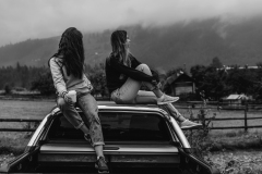 two-women-sitting-on-vehicle-roofs-2409681_sw