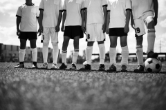 Unrecognizable Football Team in Field